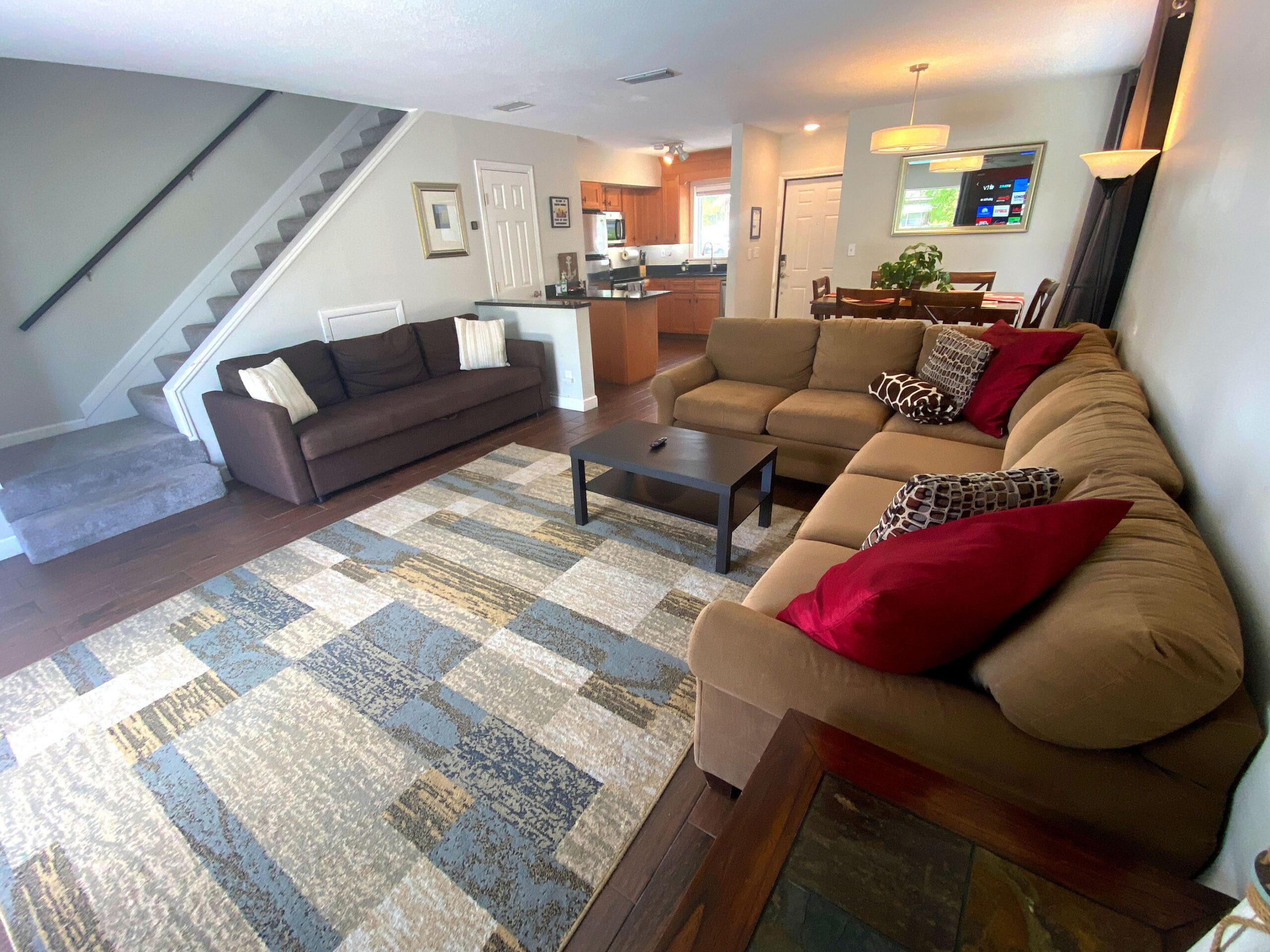 Spacious living room with sectional sofa and pool view at Tarpon Harbor 1